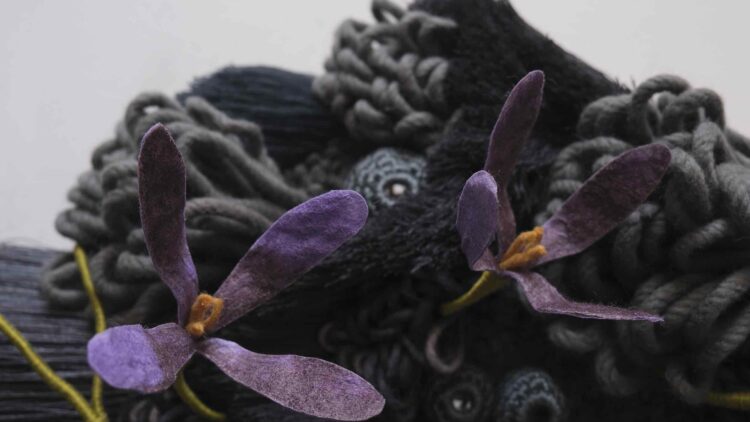 Vanessa Barragao, Afterlife IV (detail), 2023. 85cm x 23cm x 165cm (33.5" x 9" x 65"). Latch hook, crochet, fibre manipulation. Wool, tencel, jute backing, brass signature badge, repurposed fibres from textile factories.