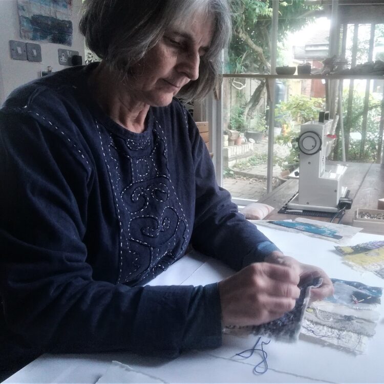 Cas Holmes working in her studio.