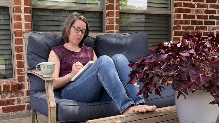 Deborah Boschert sketching on the patio.