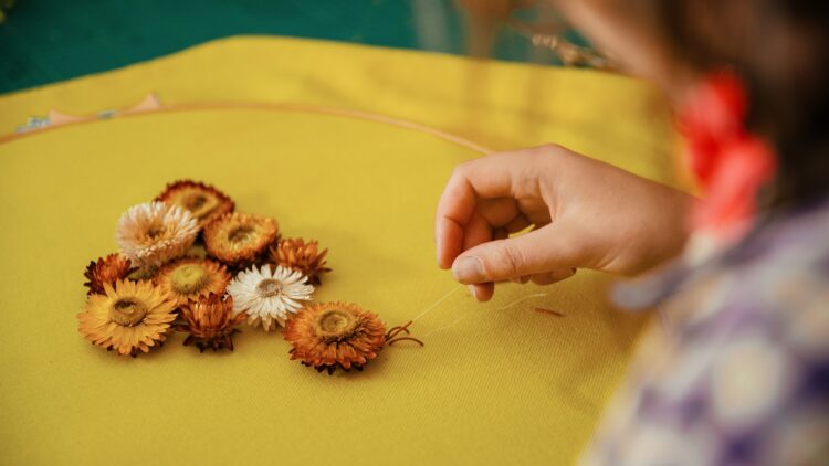 Elnaz Yazdani, Embroider with Nature, 2022. 50 x 50cm (20" x 20"). Goldwork, embellishments, beading. Wool, cornflowers, purl wire, beading thread. Photo: Bokehgo. 