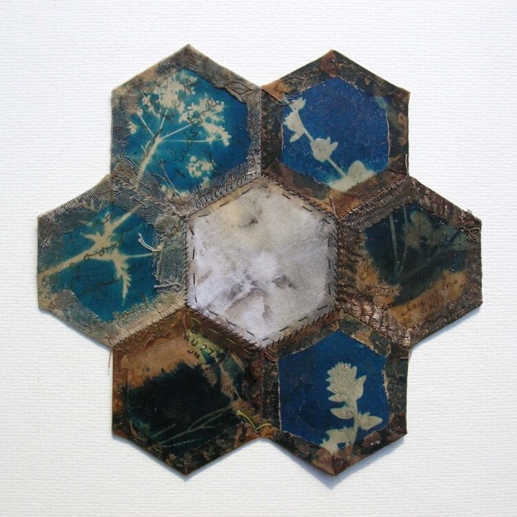 Hannah Lamb, Fragments Patched 2, 2013. 16cm x 16cm (6" x 6"). Cyanotype, natural dye and patchwork. Textile, paper and beeswax. 