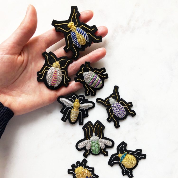 Hannah Mansfield, Goldwork Beetle Brooches, 2021. 5cm x 4cm (2” x 1 ½”). Goldwork. Goldwork wires, wool felt, brooch pins.