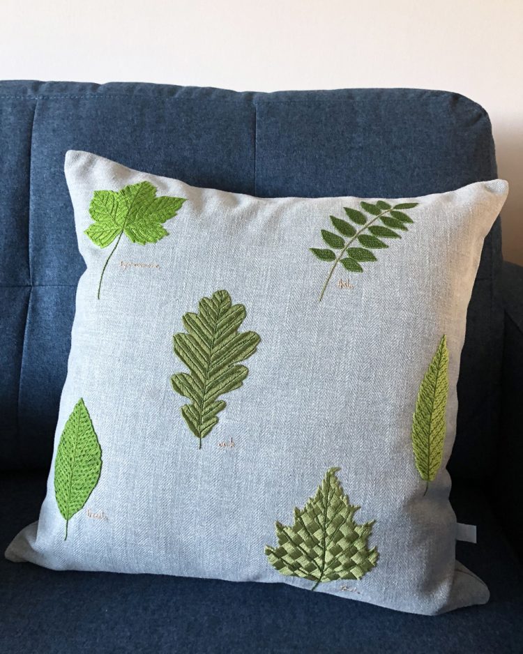 Hannah Mansfield, Leaf cushion, 2022. 50 x 50cm (19 ½” x 19 ½”). Burden stitch, long and short stitch, brick filling, basket filling, Parisian stitch and chevron filling. Pearl cotton thread, linen fabric.