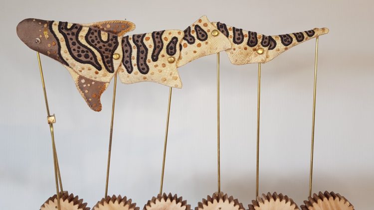 Susie Vickery, The Curious Five Go Surfing (detail: Juvenile Zebra Shark Automata), 2021. 50cm x 45cm (19½" x 17½"). Embroidery, woodwork. Silk, brass, wood, beads.